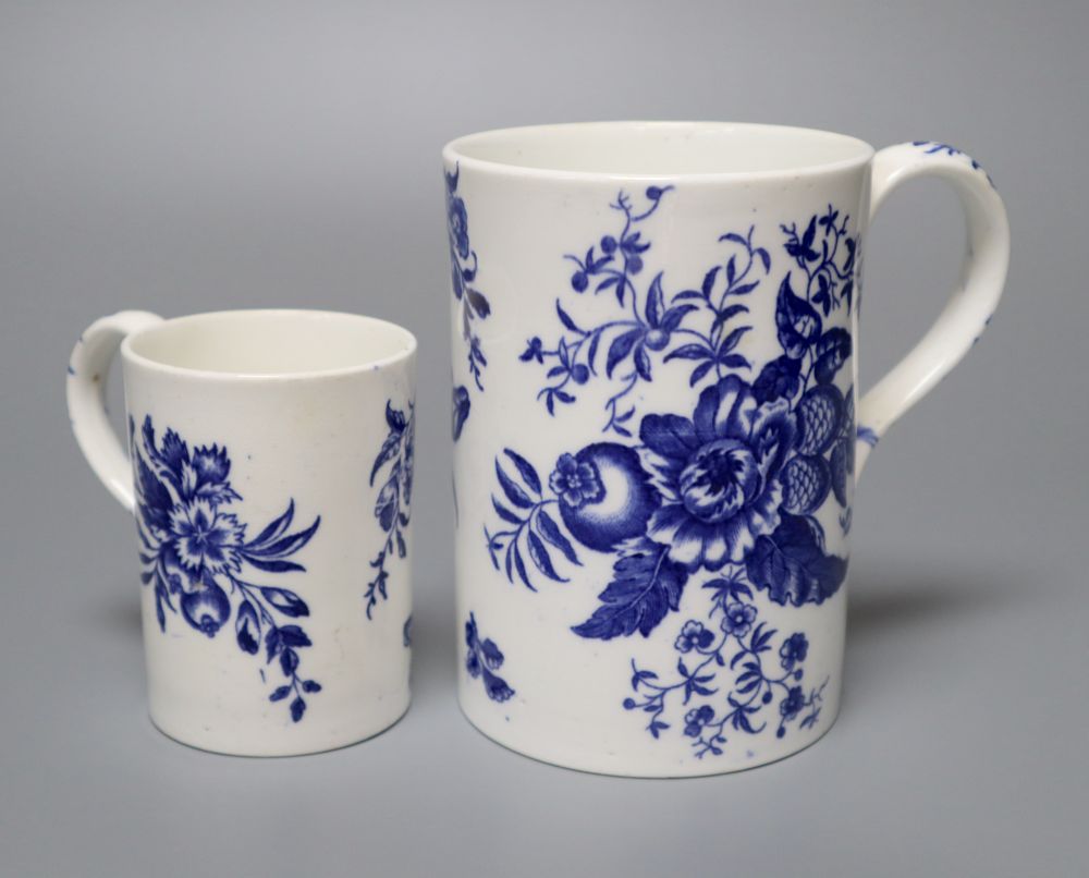 A Worcester style pine cone pattern bone china mug and a similar fruit decorated small mug, late 19th century, 12cm and 8cm